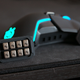 The place to put the extra weight are hidden behind the magnetic panels built into both sides of the mouse.